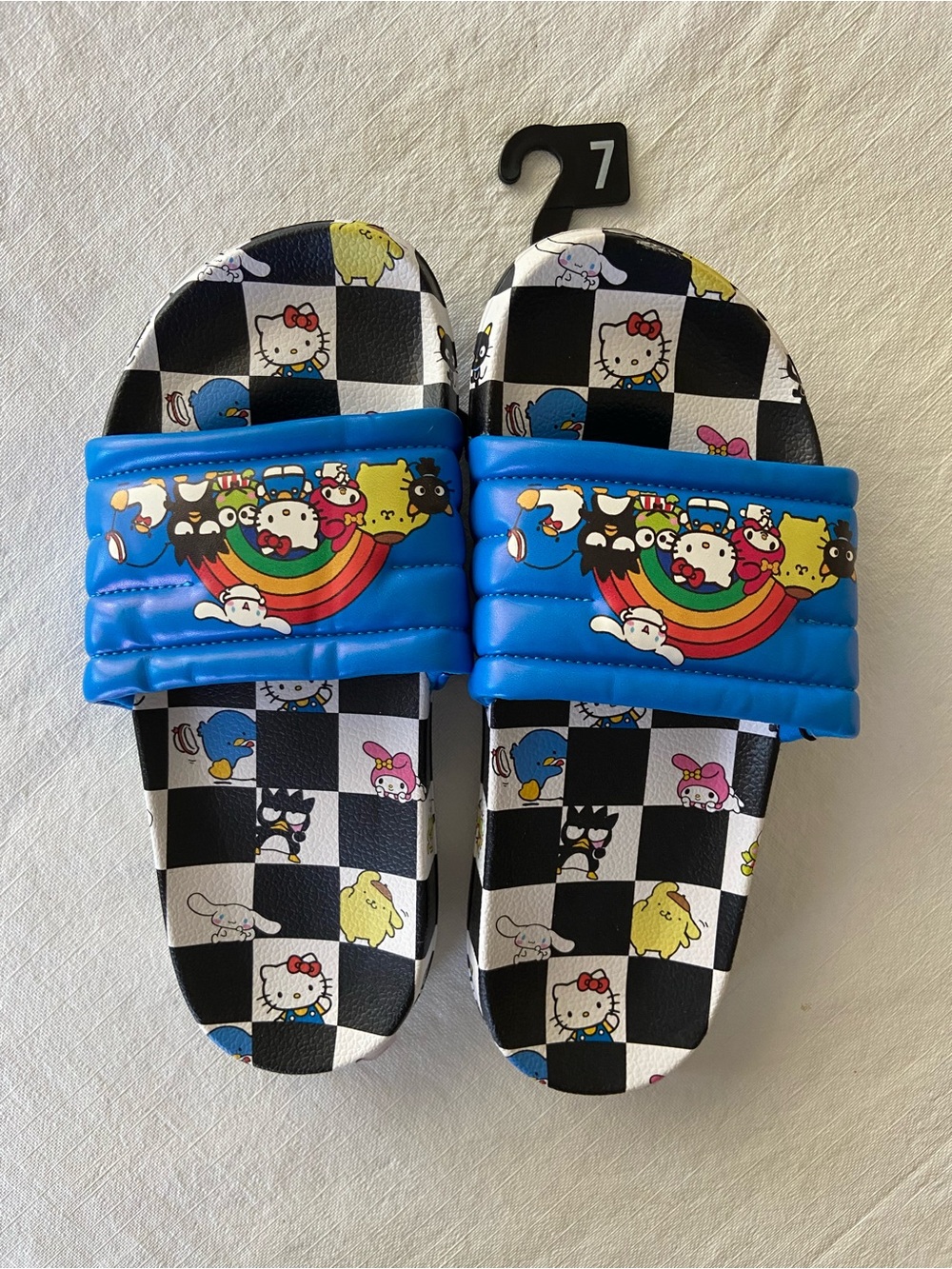 NWT Unisex Hello Kitty Size Womans size 8.5 - (Mens 7) Blue & Black Slides